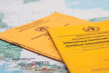 World Health Organization documents on top of a map
