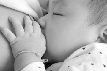 Mother breastfeeding an infant