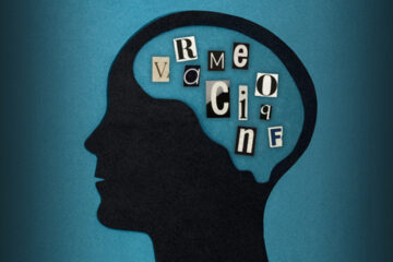A profile illustration of a person with random letters in their brain to symbolize what is aphasia